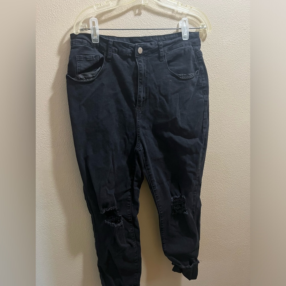 Black skinny jeans with knee holes